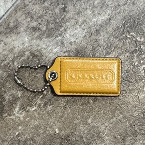 Coach Mustard Yellow Leather Bag tag